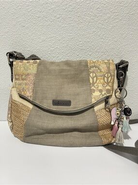 Sakroots grey and beige fold over crossbody purse with bag charm